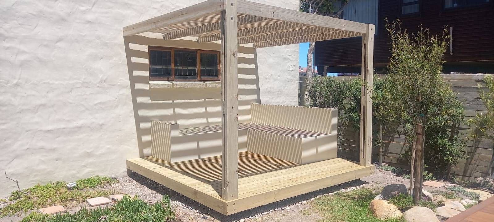 Finished pergola with built-in seating