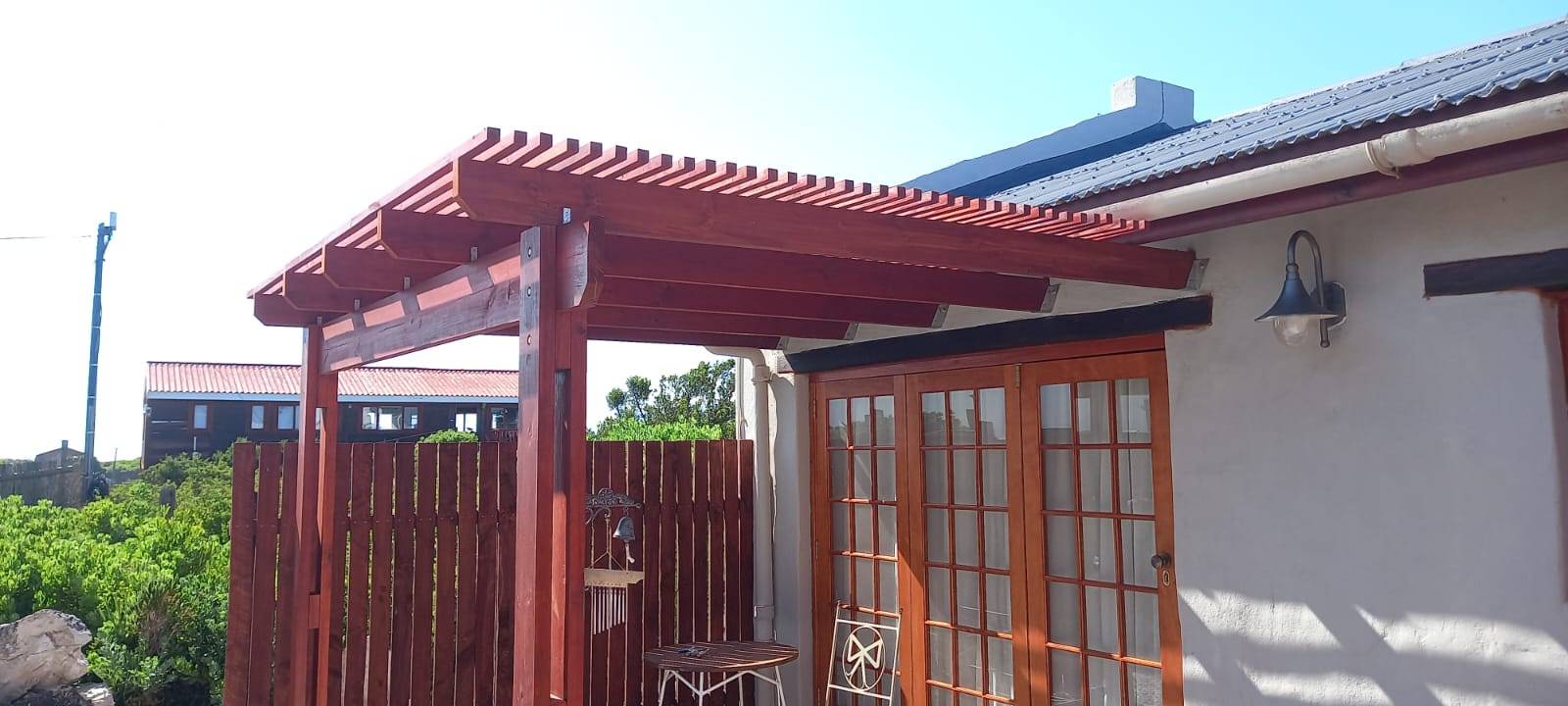Red pergola, French doors