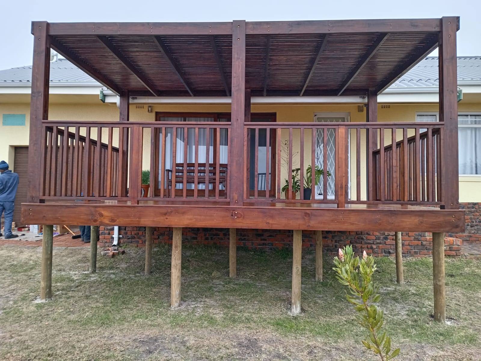 Large pergola, yellow house